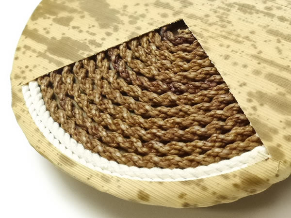 Close-up of the twisted paper cord core beneath the bamboo sheath
